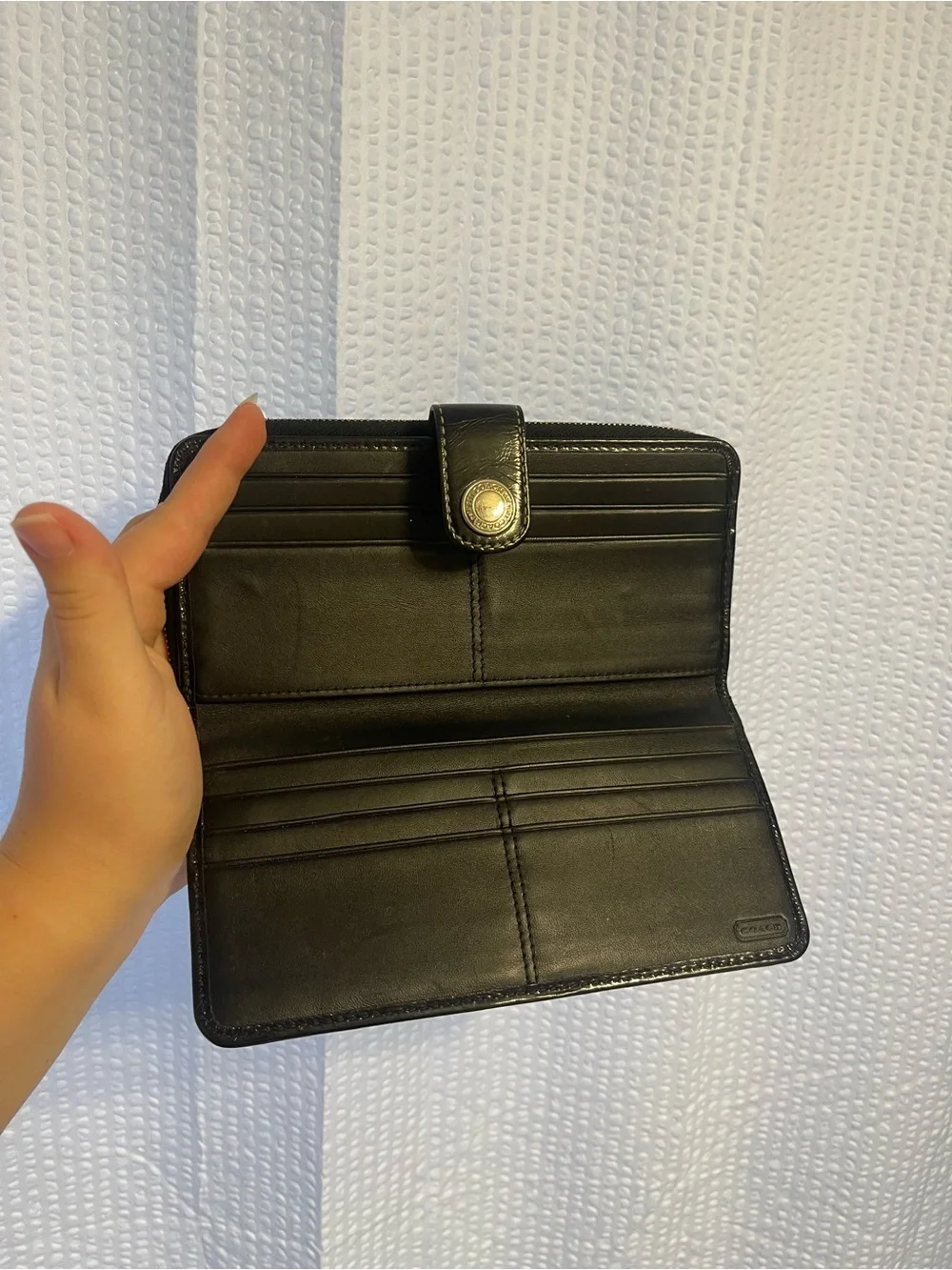 48. Coach wallet.